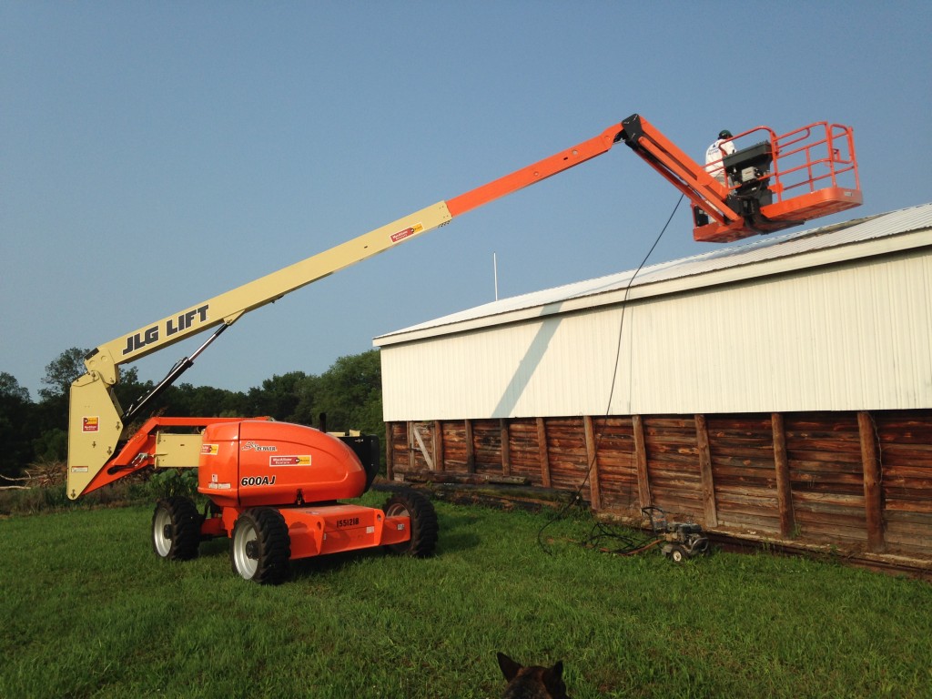 Pole barn getting its hair did by Russell Painting